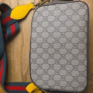 Brown and Yellow Crossbody Bag with Monogram Design